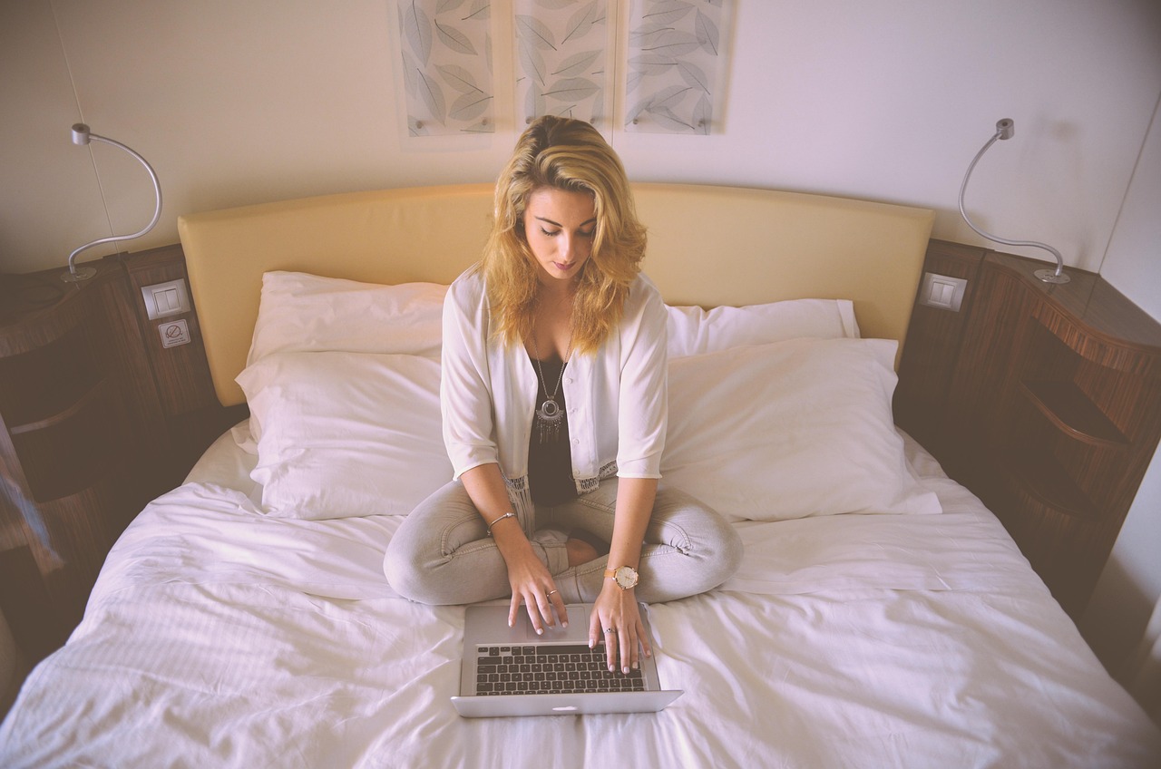 Irish person checking US lottery results on laptop at home casual setting