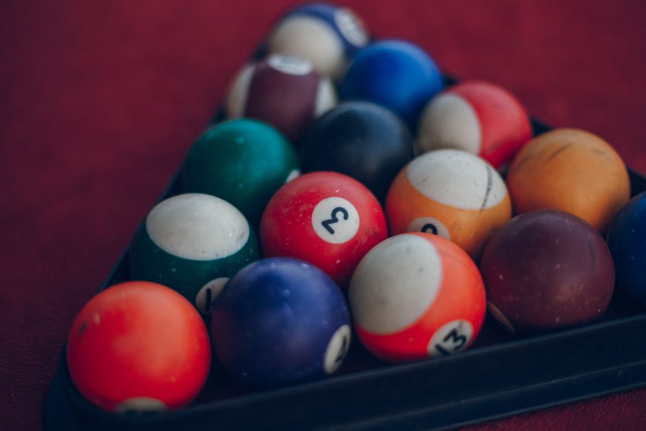 EuroJackpot lottery balls low numbers on dark background