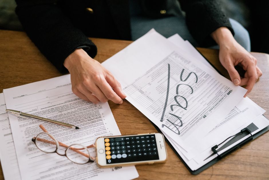 tax forms and lottery tickets with calculator