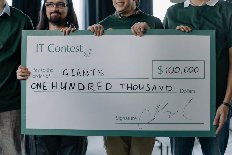powerball lottery winner celebration Powerball winners holding oversized checks in casual settings